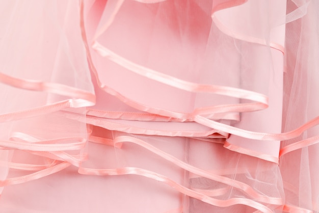 Wedding dress detail. Pink wedding dress frills close up.