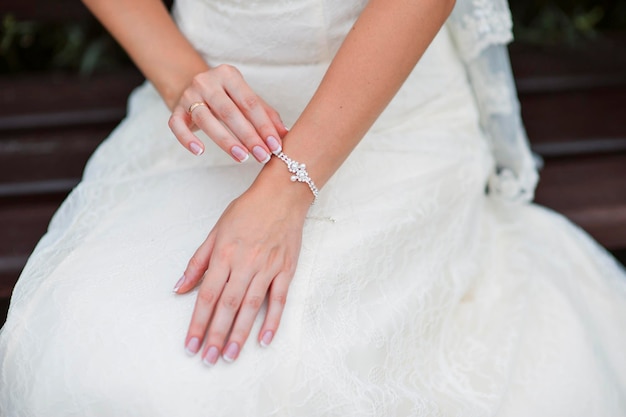 Wedding gloves on hands of bride closeup