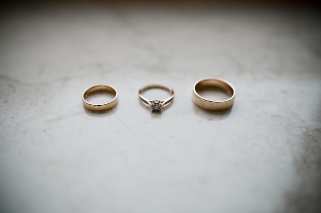 Wedding gold rings lie on the table