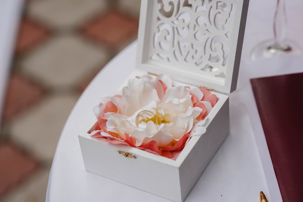 Wedding rings close-up in a beautiful box, during the bride's gathering. Accessories