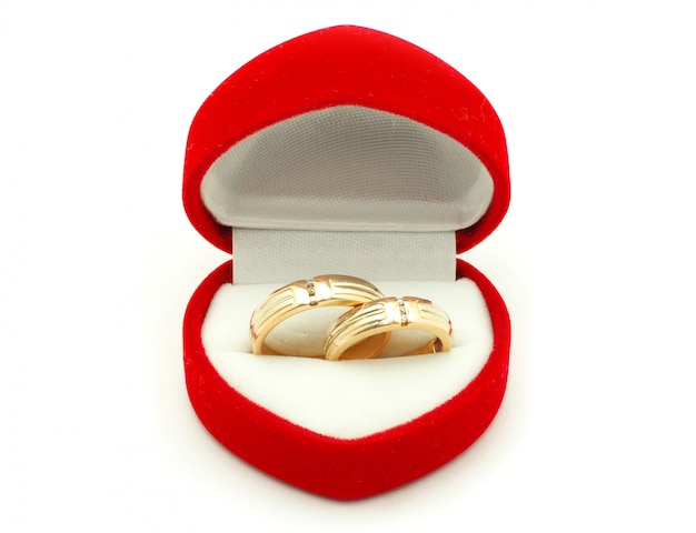 Wedding rings in a heart-shaped red box