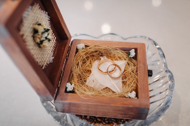 Photo wedding rings in the jewelry box at the wedding ceremony