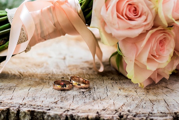 Wedding rings lie and beautiful bouquet