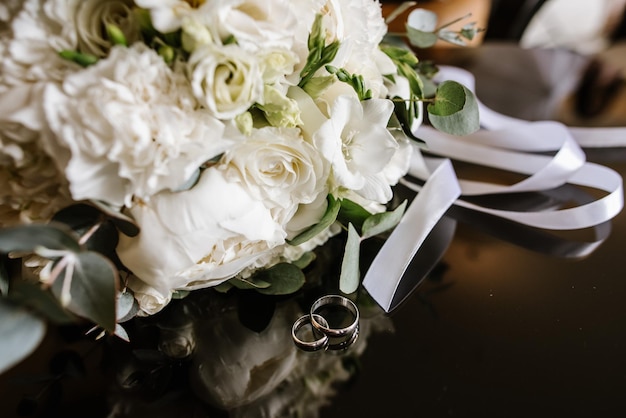 Wedding rings with decorations on wedding day preparations