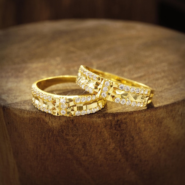 wedding rings on wooden background