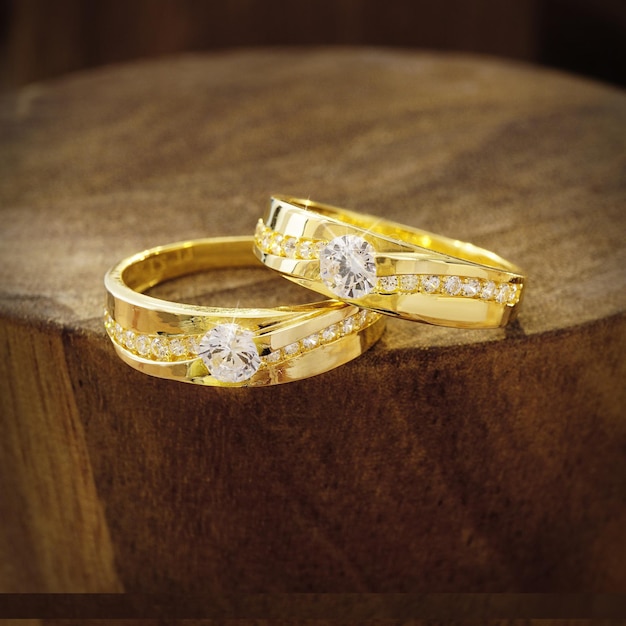 wedding rings on wooden background