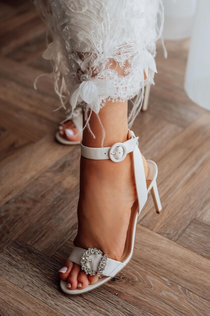 Wedding shoes on feet of bride