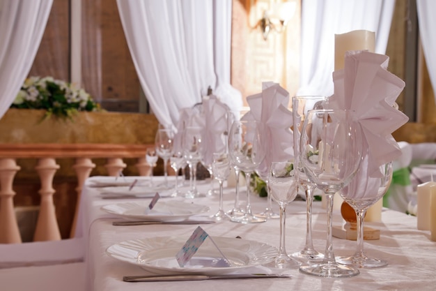 Wedding table decor in restaurant on background of interior