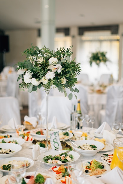 Wedding table decorated with white flowers