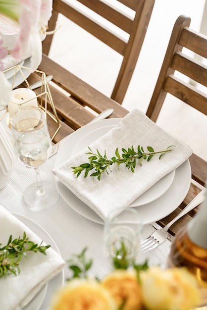 The wedding table setting and decor on wooden table in rustic style