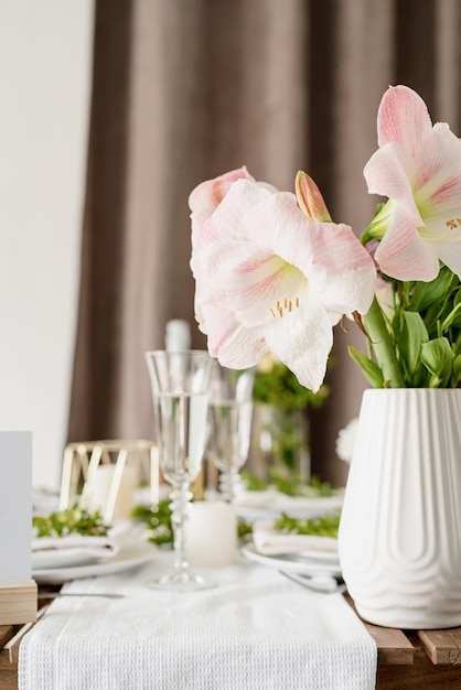 The wedding table setting and decor on wooden table in rustic style