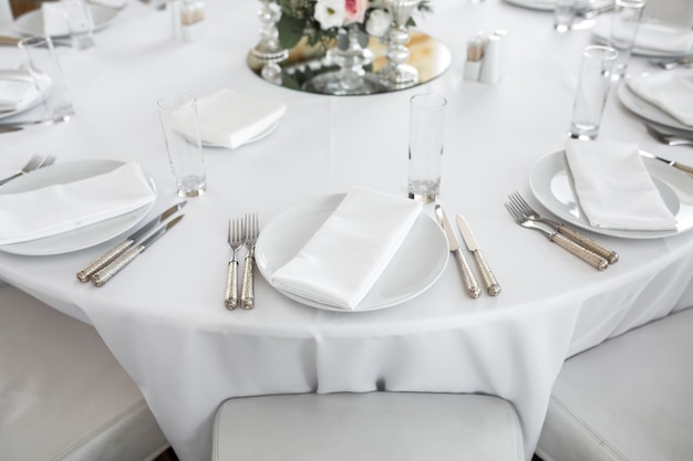 Wedding table setting decorated with fresh flowers