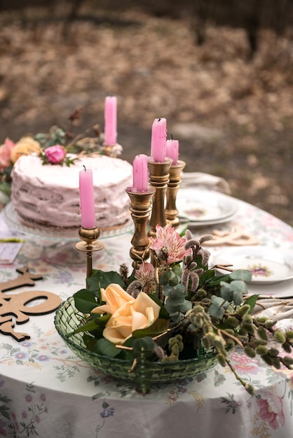 Wedding table with candles and cake closeup