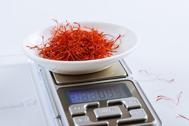 Weighing saffron threads on digital jewelry scales