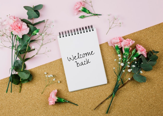 Welcome back message and flowers