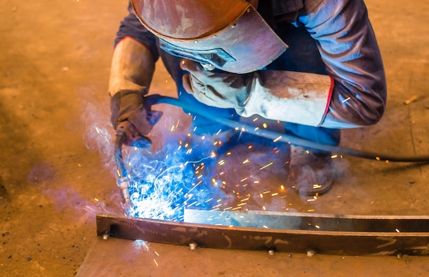 Welder and bright sparks. Production and construction