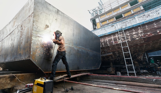 Welder man working in local shipyard.