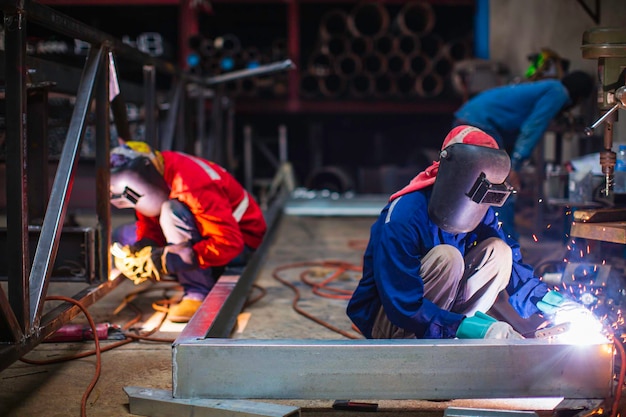 Welding male worker metal steel is part of beam structure