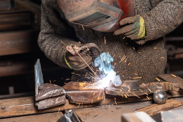 Welding process in the industrial workshop by worker