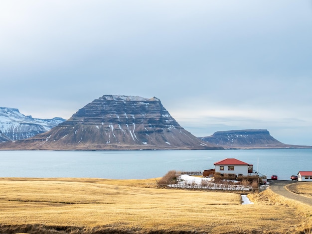 Well known popular landmark of Iceland Kirkjufell mountain in opposite side with surrounding lake