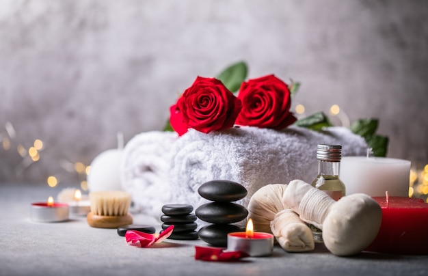 Wellness decoration, spa massage setting,  oil on stone background. Valentine's day