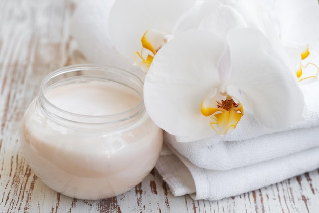 Wellness and spa scene with orchids and beauty cream