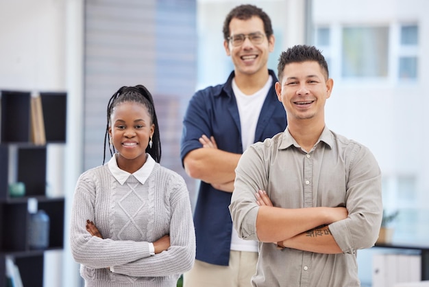 Were the ones who make things happen Shot of a diverse group of businesspeople standing together in the office with their arms folded