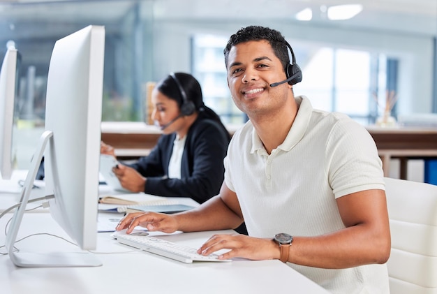 Were the problem solvers of the company Shot of two young businesspeople sitting in the office together and wearing headsets while using computers