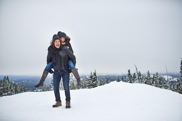 Were up to snow good Shot of a happy young couple enjoying themselves while being out in the snow