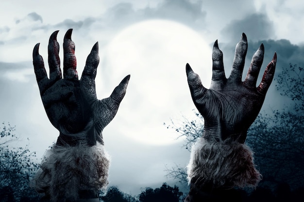 Werewolf hand with a full moon