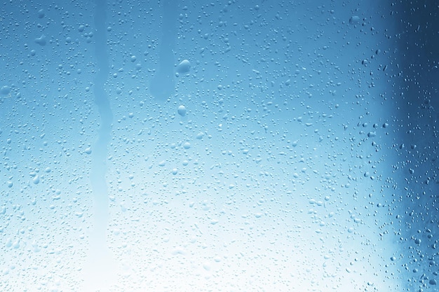 wet glass background condensate / abstract rain, drops texture on transparent glass