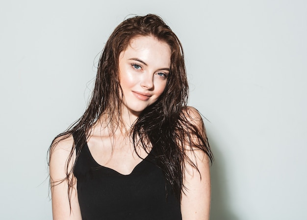 Wet hair woman portrait, beauty hair healthy skin care concept, beautiful model with wet hair. Gray backgound.