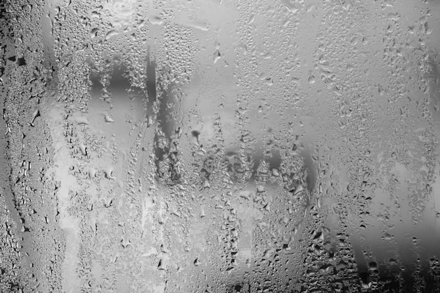 Wet misted glass with drops of water Abstract background