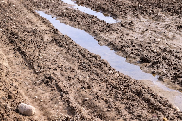 Wet soil mud on an agricultural field