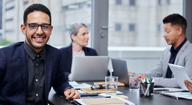 Weve been working on some solid strategies for success Portrait of a young businessman having a meeting with his colleagues in a boardroom