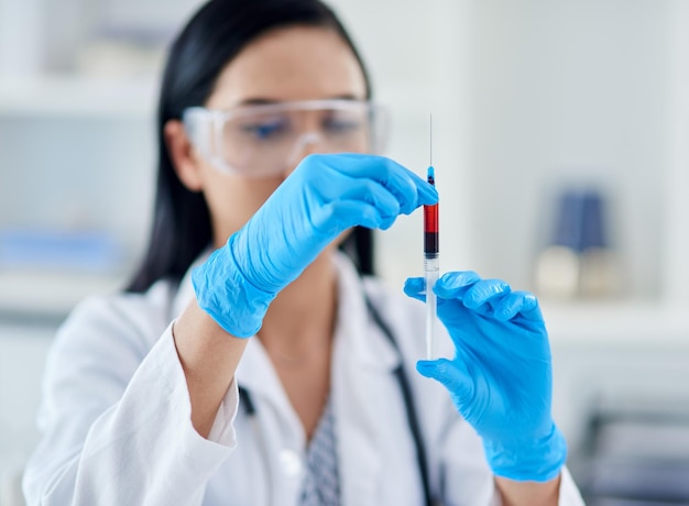 What does this patients blood say about their health Shot of a young scientist conducting an experiment in a laboratory