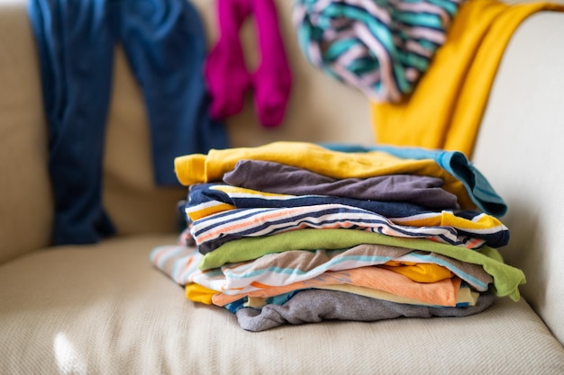 What to wear Messy colorful clothing on a sofa