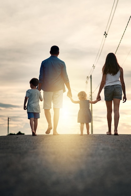 What a wonderful walk we enjoyed as a family Rearview shot of an unrecognizable family walking together in the neighbourhood