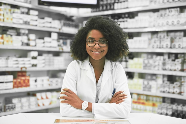 Whats on the menu today Portrait of a cheerful young female pharmacist standing with arms folded while looking at the camera in a pharmacy