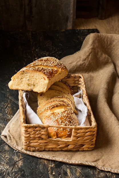 wheat bread on natural linen napkin and bag. Homemade bakery. Still life of bread. Slice o