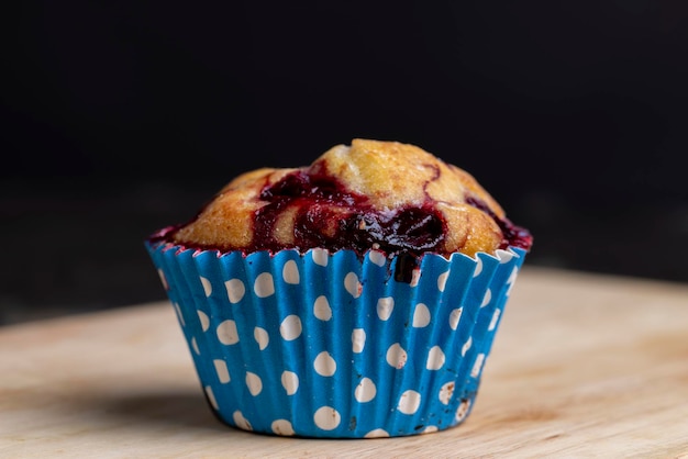 Wheat cupcake with red cherries