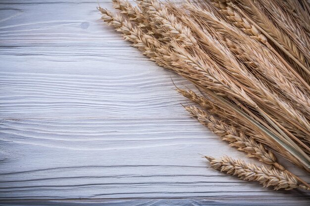 Wheat ears on wood