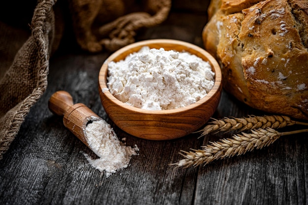 Wheat flour on an old wooden table