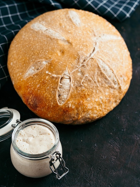 Photo wheat round sourdough bread copy space vertical