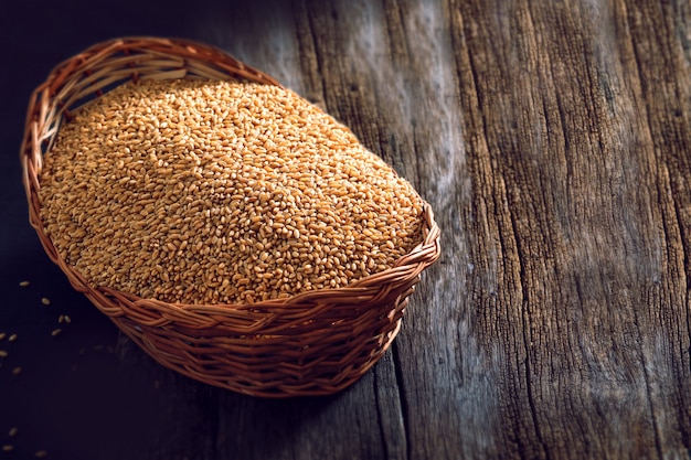  wheat in wooden bowl on wooden background