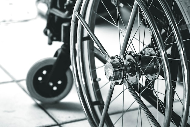 a wheelchair in black and white closeup photo