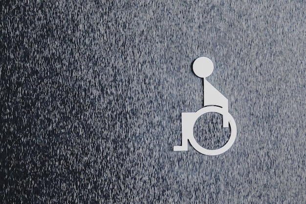 A wheelchair sign is placed on the handicapped bathroom door