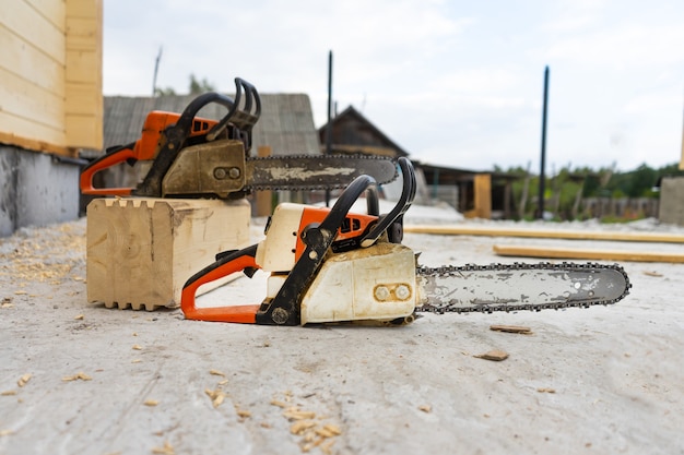 When construction a wooden house, two chainsaws a bit.