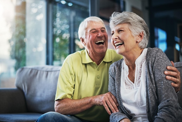 When youre laughing youre living Shot of a happy senior couple relaxing together on the sofa at home