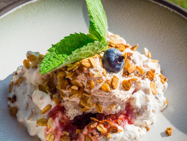 Whipped cream with berry and oatmeal delicious dessert